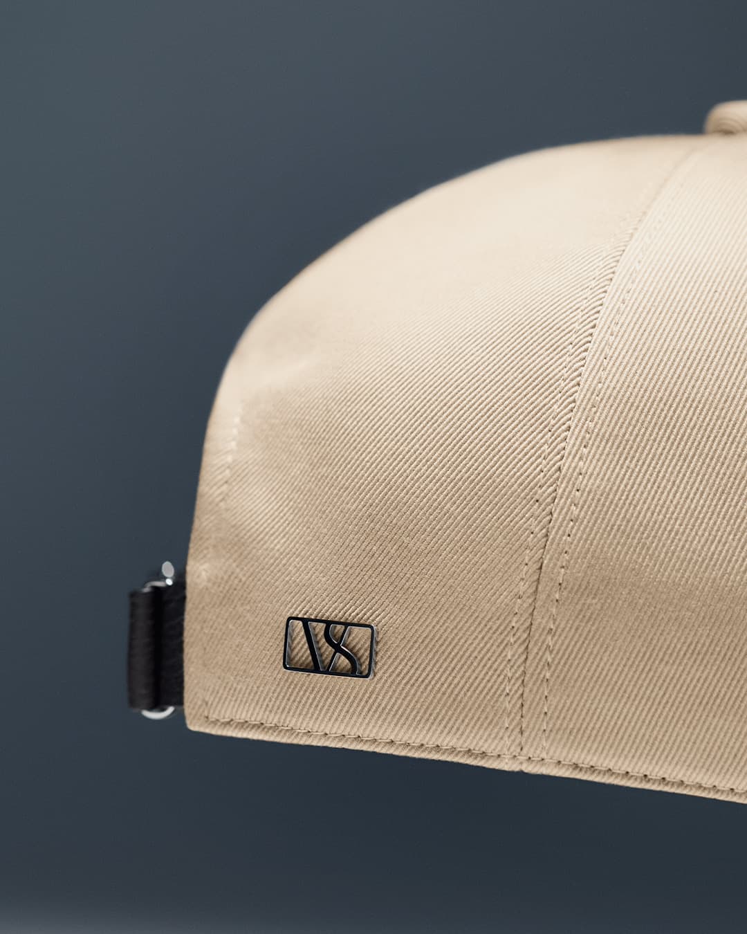 Detailed back view of a beige sea island cotton cap from varsity headwear