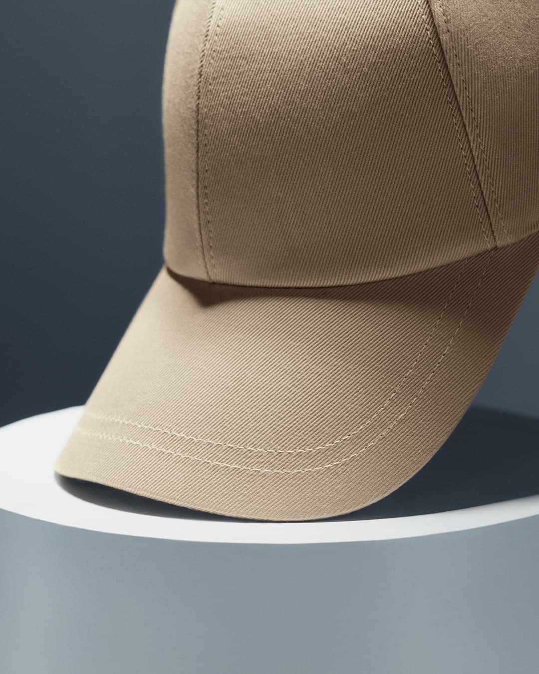 Detailed front view of a beige sea island cotton cap from varsity headwear