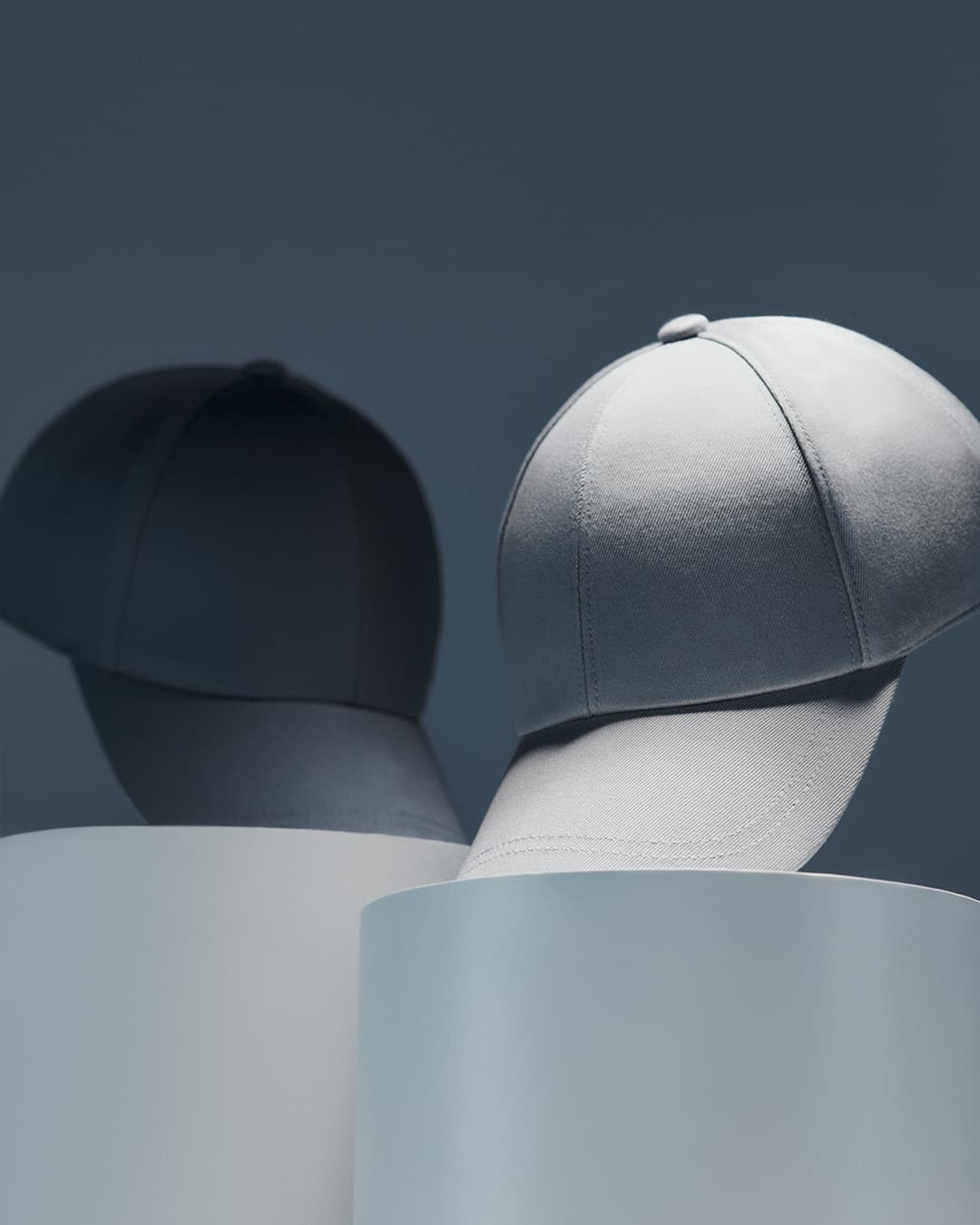 Front view of grey and blue sea island cotton caps from varsity headwear