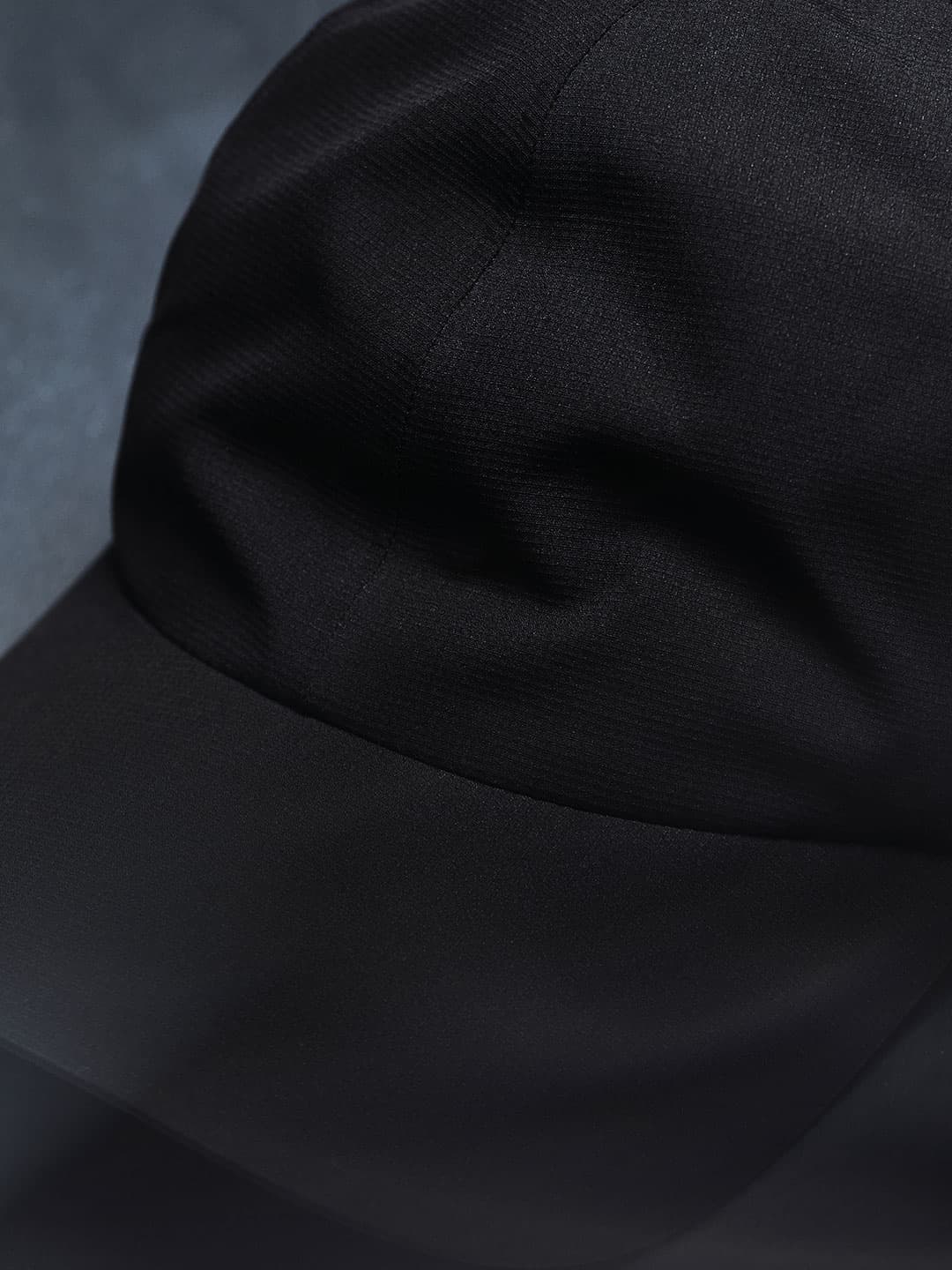 Close view og a black high intensity sport cap from varsity headwear