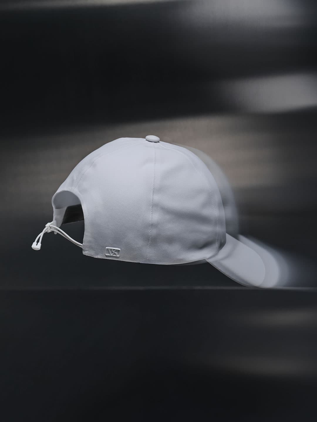 Back view of a white high intensity sport cap from varsity headwear