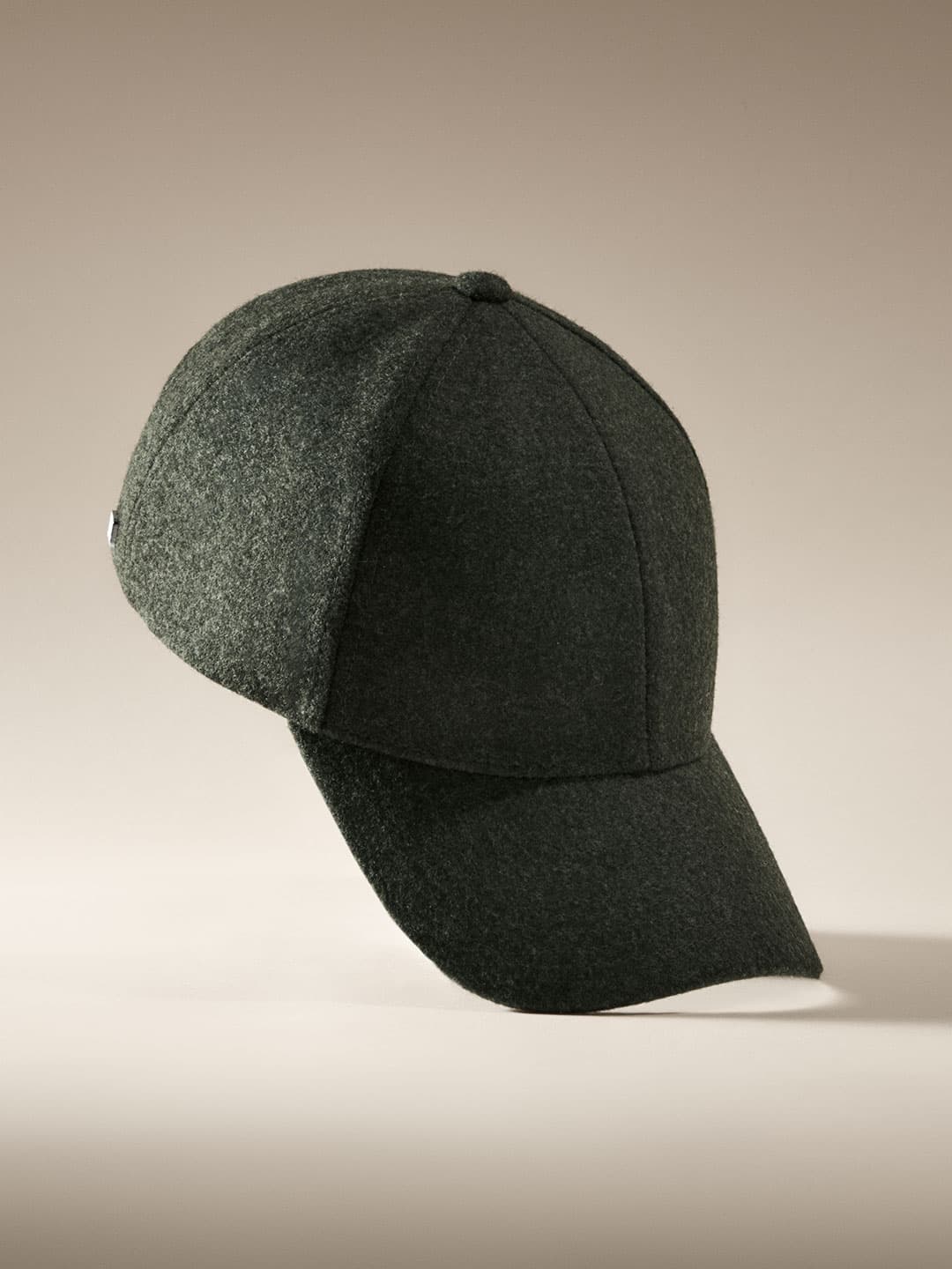 Side view of a legacy structured forest green wool cap from Varsity Headwear