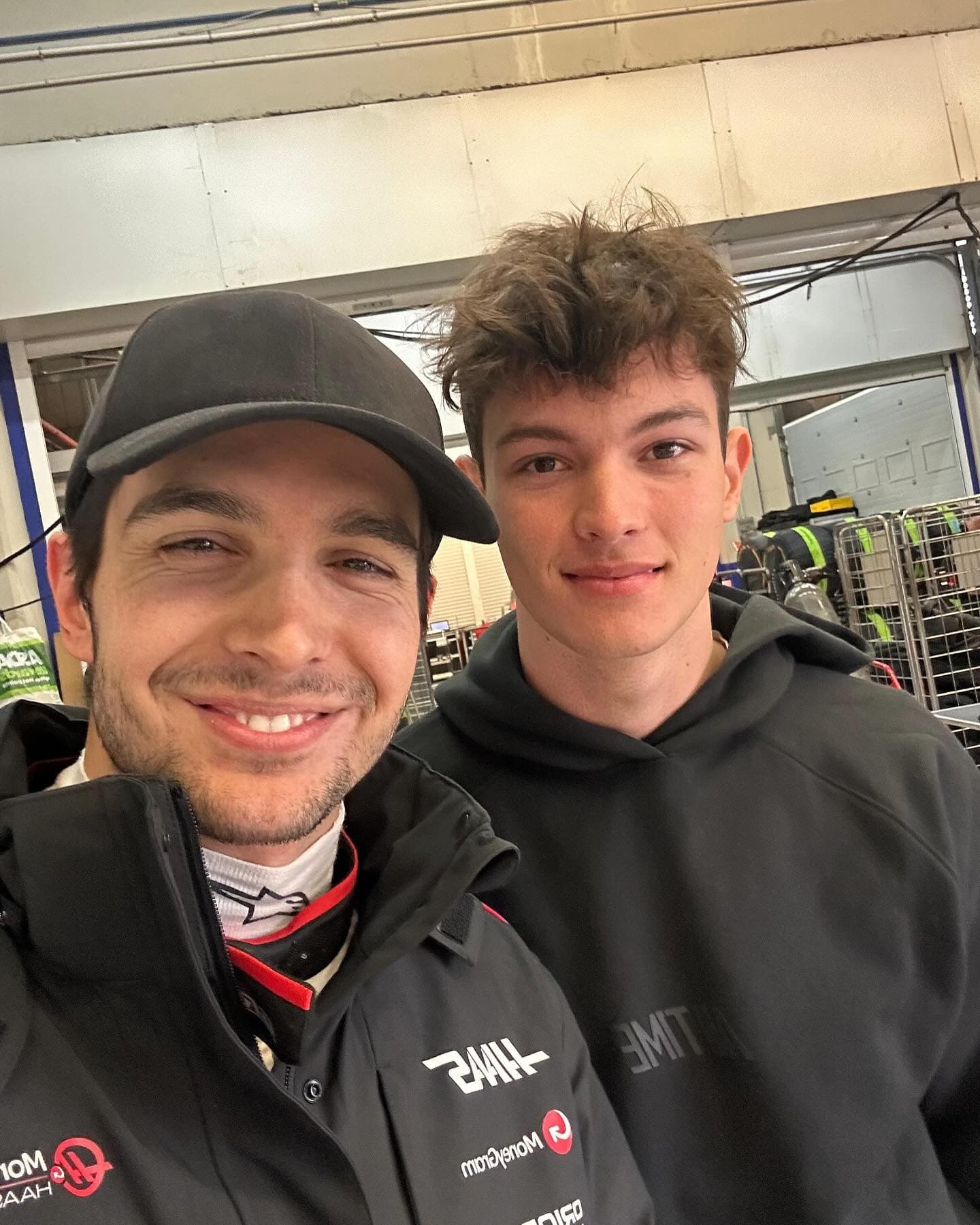 Formula 1 driver Estaban Ocon wearing a black alcantara cap from Varisty Headwear