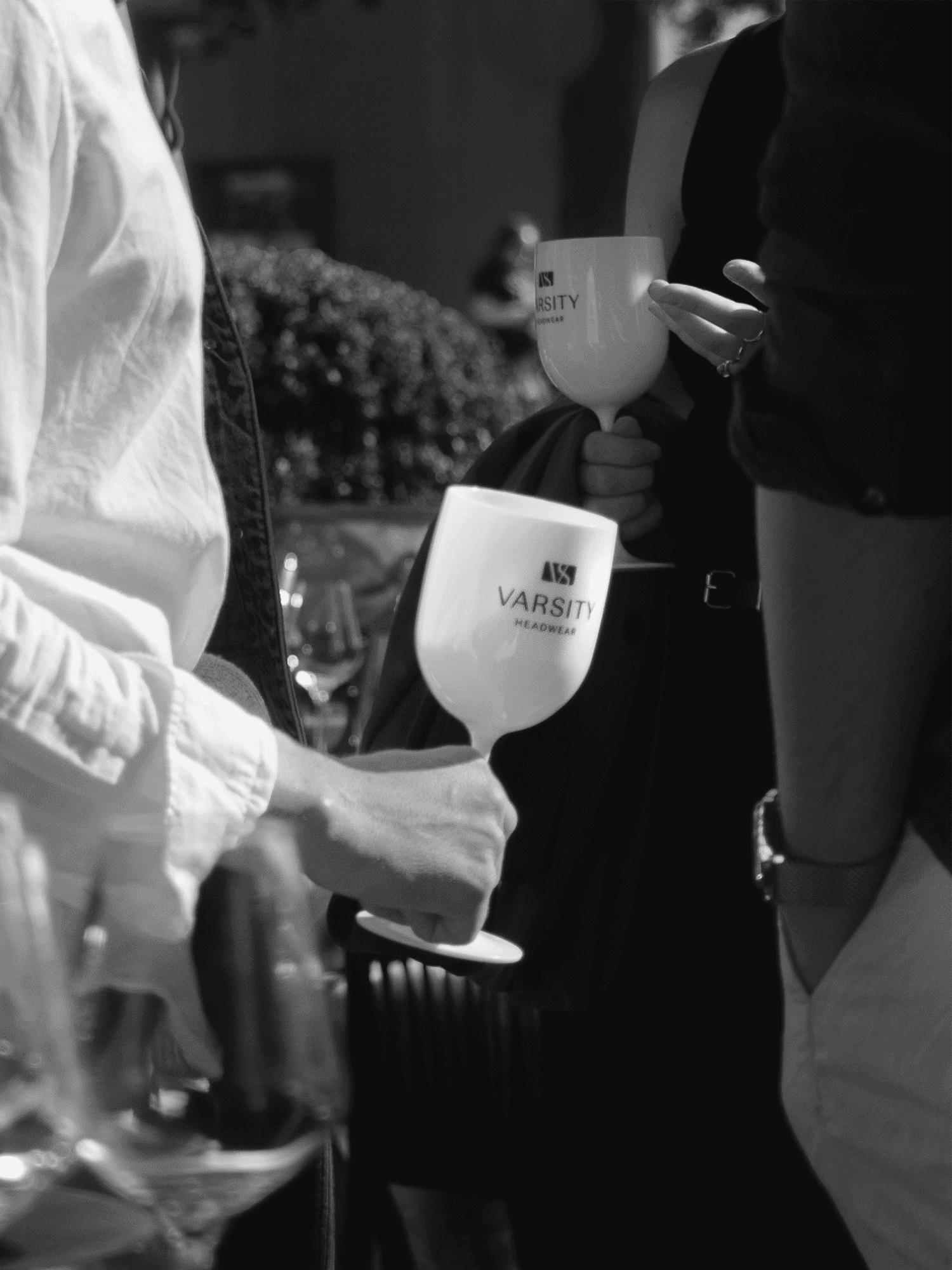 Close-up image of a VH glas from a varsity headwear owners club event