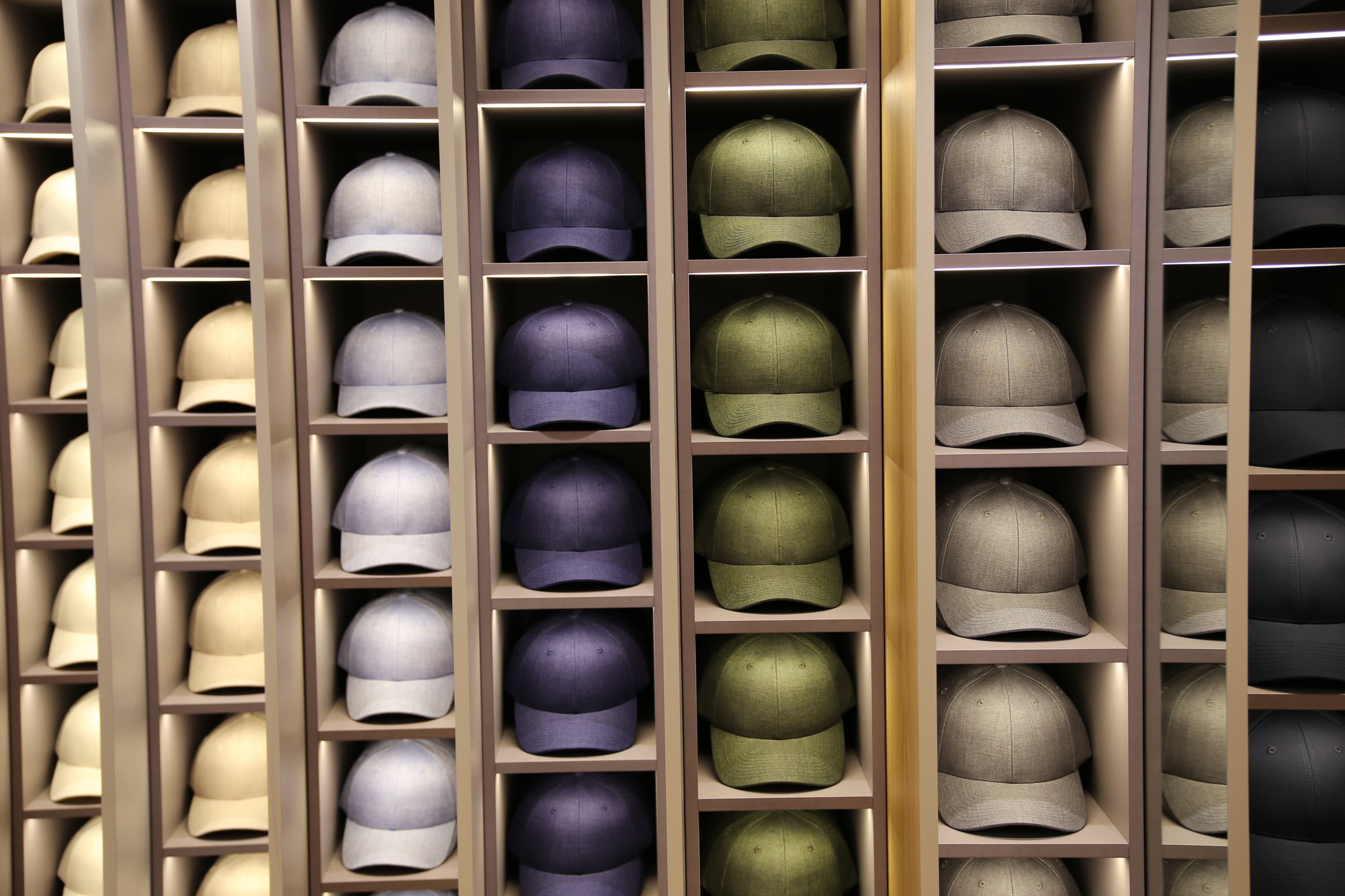 Front view of caps in shelves in Saint Tropez store