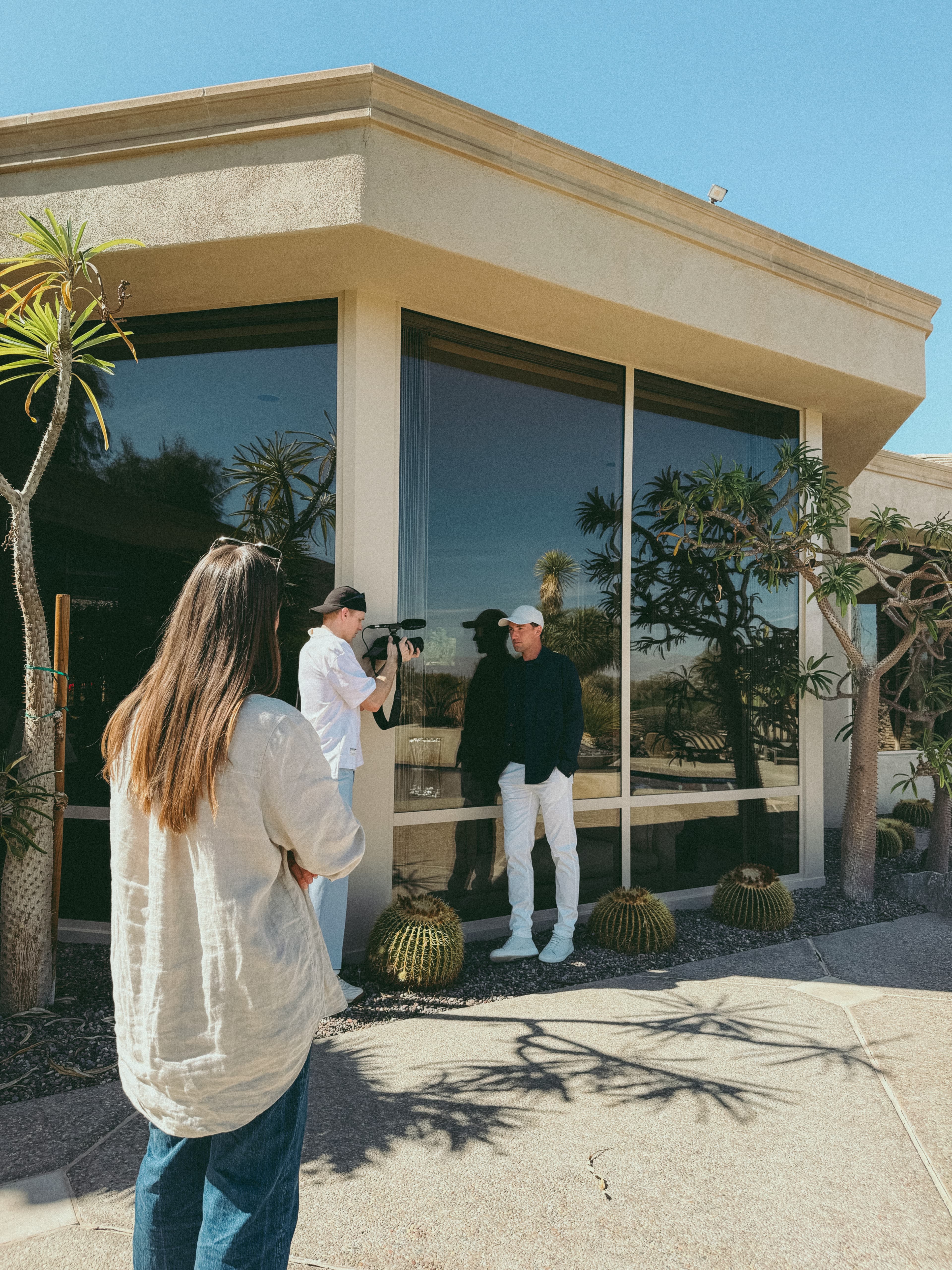 Behind the scenes image of team taking photos of Casper Ruud for the campaign shoot in Palm Springs