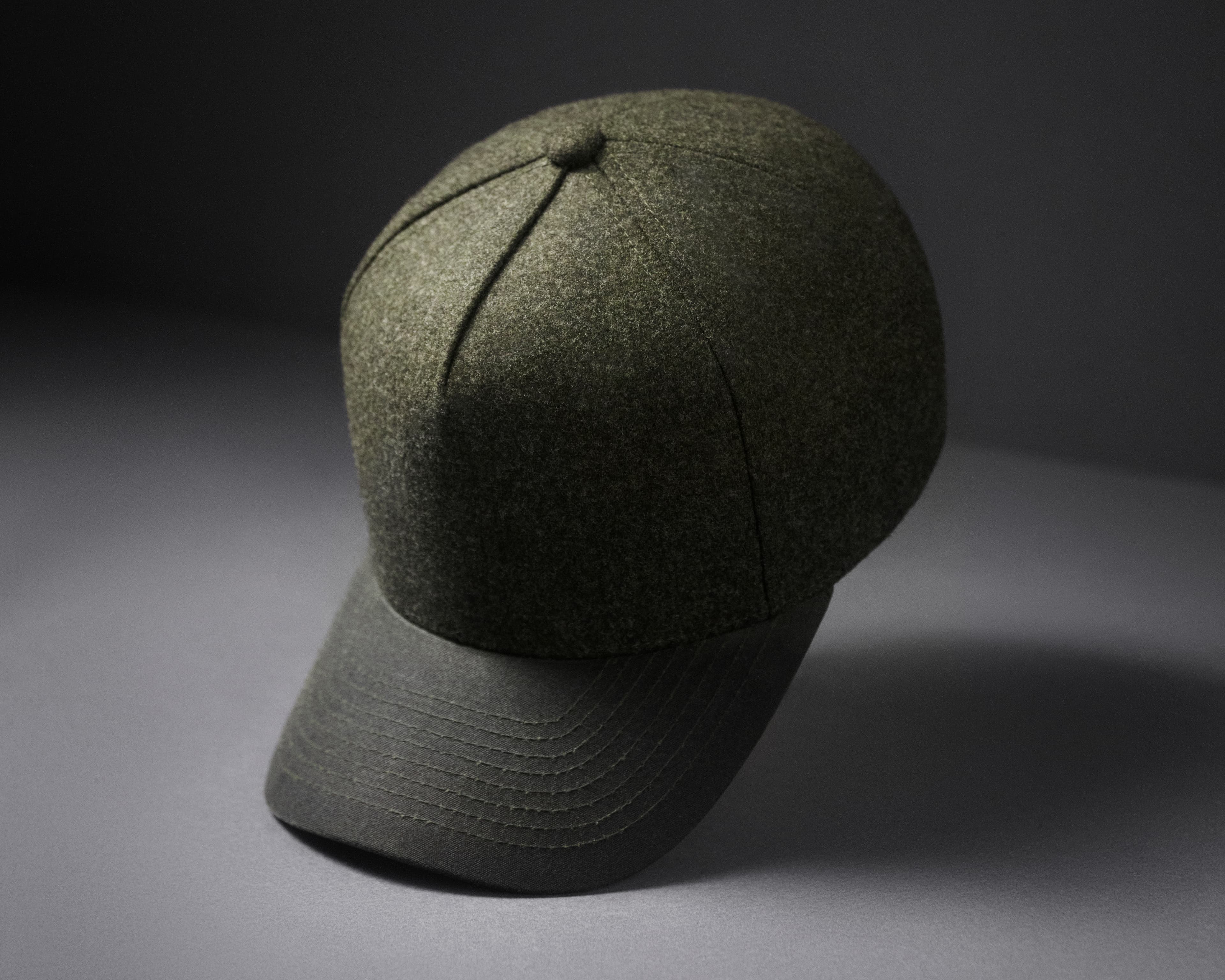 Front view of a green Cruz dual wool cap from varsity headwear
