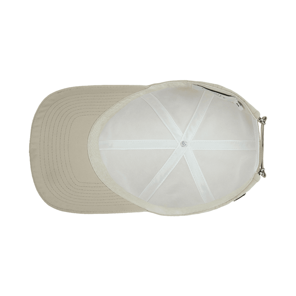 Inside view of a Varsity Headwear legacy soft seaqual dune beige baseball cap